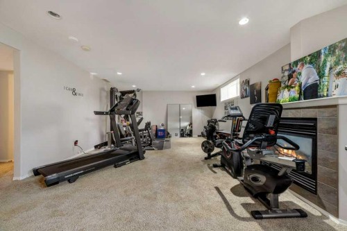 215 Grand River Boulevard West, Lethbridge, AB - Indoor Photo Showing Gym Room
