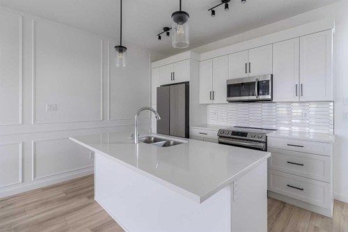633 Blackwolf Boulevard North, Lethbridge, AB - Indoor Photo Showing Kitchen With Stainless Steel Kitchen With Double Sink With Upgraded Kitchen