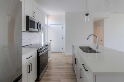 633 Blackwolf Boulevard North, Lethbridge, AB - Indoor Photo Showing Kitchen With Double Sink With Upgraded Kitchen