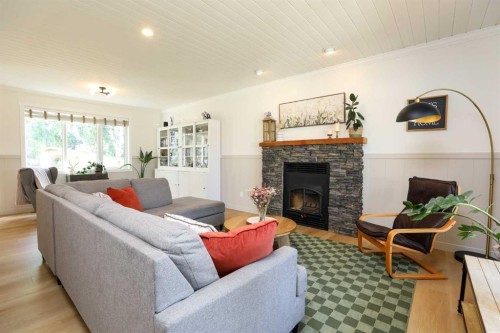2135 33 Avenue, Coaldale, AB - Indoor Photo Showing Living Room With Fireplace