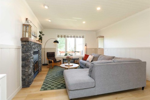 2135 33 Avenue, Coaldale, AB - Indoor Photo Showing Living Room With Fireplace