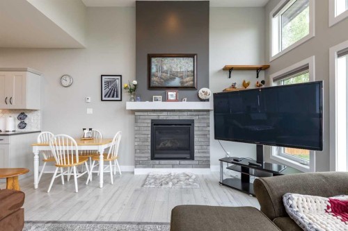 107 Westgate Drive, Coaldale, AB - Indoor Photo Showing Living Room With Fireplace