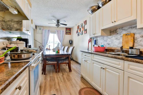1717 St Edward Boulevard North, Lethbridge, AB - Indoor Photo Showing Kitchen With Double Sink
