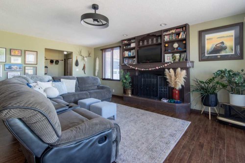 5-94046 Highway 843, Rural Lethbridge County, AB - Indoor Photo Showing Living Room With Fireplace