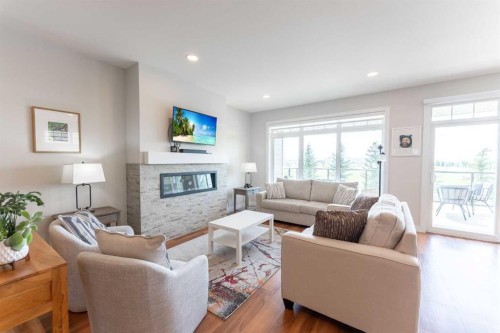 1060 Caledonia Place West, Lethbridge, AB - Indoor Photo Showing Living Room With Fireplace