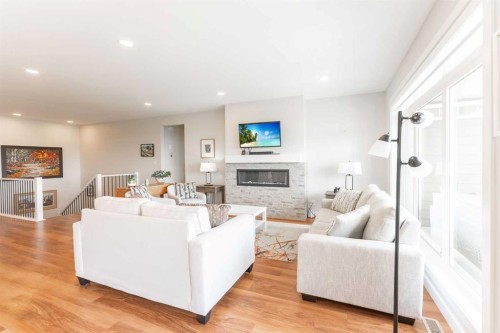 1060 Caledonia Place West, Lethbridge, AB - Indoor Photo Showing Living Room With Fireplace