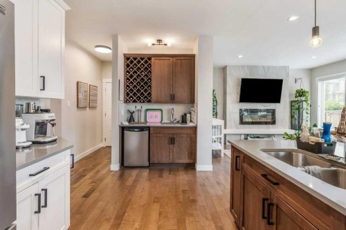855 Miners Boulevard West, Lethbridge, AB - Indoor Photo Showing Kitchen With Fireplace With Double Sink