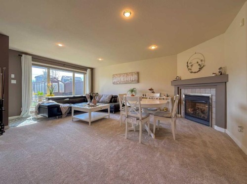 534 Canyon Cove West, Lethbridge, AB - Indoor Photo Showing Living Room With Fireplace