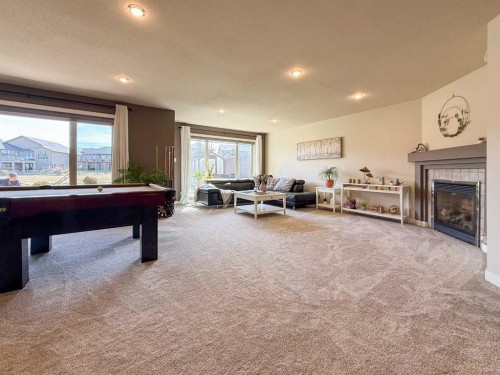 534 Canyon Cove West, Lethbridge, AB - Indoor Photo Showing Other Room With Fireplace