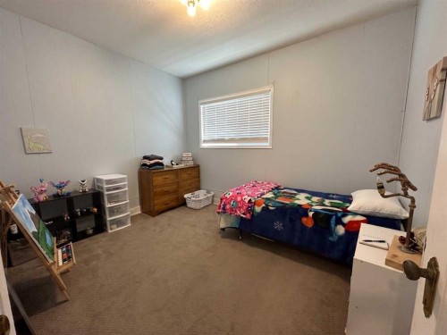 8017 22 Avenue, Coleman, AB - Indoor Photo Showing Bedroom