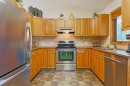 110 Heritage Boulevard West, Lethbridge, AB  - Indoor Photo Showing Kitchen With Double Sink 