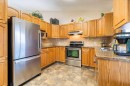110 Heritage Boulevard West, Lethbridge, AB  - Indoor Photo Showing Kitchen With Double Sink 