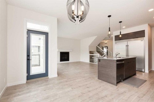 889 Atlantic Cove West, Lethbridge, AB - Indoor With Fireplace