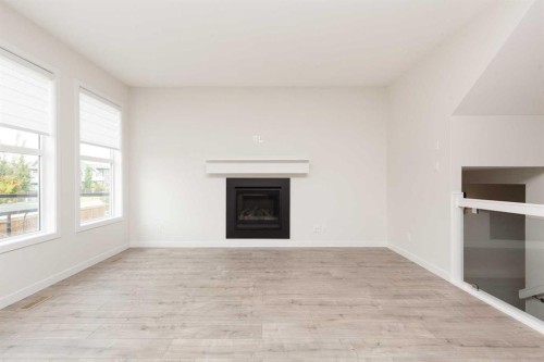 889 Atlantic Cove West, Lethbridge, AB - Indoor Photo Showing Living Room With Fireplace