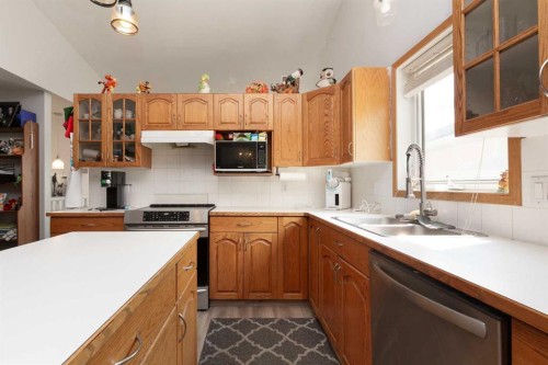 14 Heritage Road West, Lethbridge, AB - Indoor Photo Showing Kitchen With Double Sink