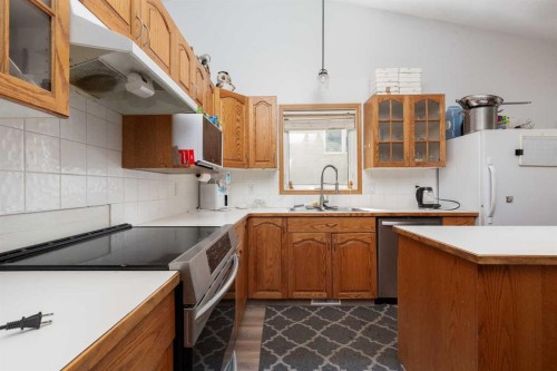14 Heritage Road West, Lethbridge, AB - Indoor Photo Showing Kitchen With Double Sink