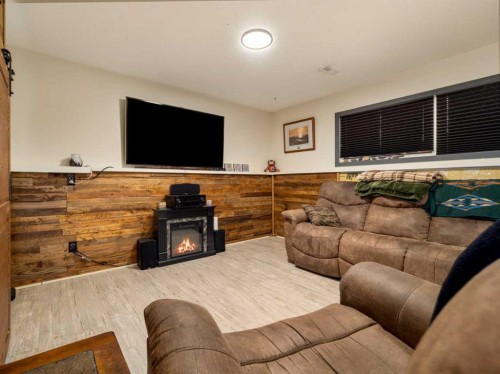 2501 & 2503 24 Street, Coaldale, AB - Indoor Photo Showing Living Room With Fireplace