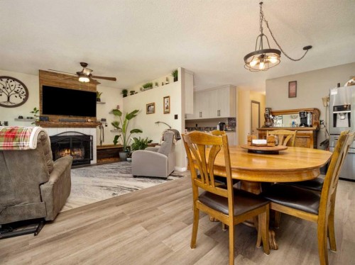 2501 & 2503 24 Street, Coaldale, AB - Indoor Photo Showing Dining Room With Fireplace