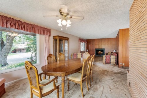 1301 15 Avenue South, Lethbridge, AB - Indoor Photo Showing Dining Room With Fireplace