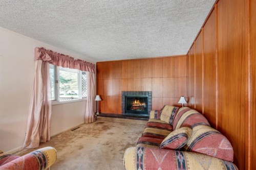 1301 15 Avenue South, Lethbridge, AB - Indoor Photo Showing Living Room With Fireplace