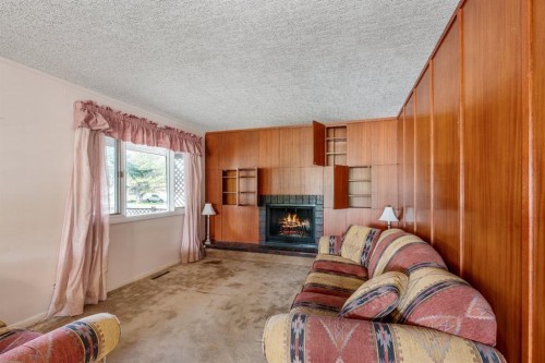 1301 15 Avenue South, Lethbridge, AB - Indoor Photo Showing Living Room With Fireplace