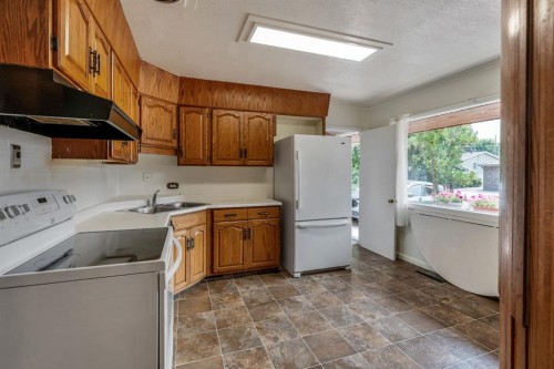 1301 15 Avenue South, Lethbridge, AB - Indoor Photo Showing Kitchen With Double Sink