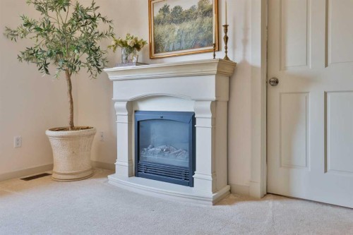 304 S 150 W, Raymond, AB - Indoor Photo Showing Other Room With Fireplace
