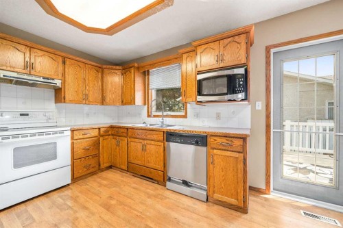 4129 55 Street, Taber, AB - Indoor Photo Showing Kitchen With Double Sink