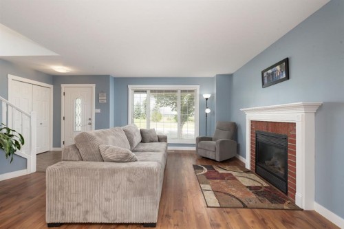 86 Riverstone Boulevard West, Lethbridge, AB - Indoor Photo Showing Living Room With Fireplace