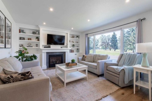 3621 Redwood Road South, Lethbridge, AB - Indoor Photo Showing Living Room With Fireplace