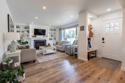3621 Redwood Road South, Lethbridge, AB - Indoor Photo Showing Living Room With Fireplace