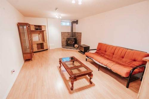 2305 7 Avenue North, Lethbridge, AB - Indoor Photo Showing Living Room With Fireplace