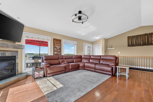 65004 Range Road 19-5, Stirling, AB - Indoor Photo Showing Living Room With Fireplace
