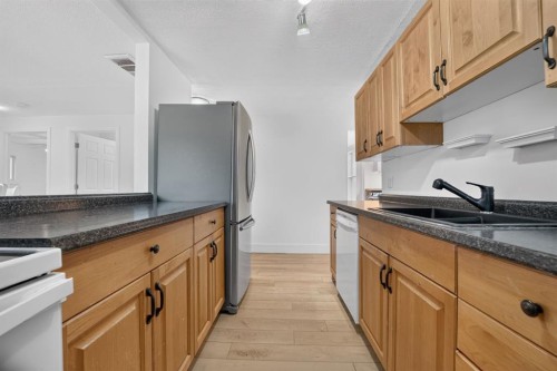 233 4 Street, Stirling, AB - Indoor Photo Showing Kitchen With Double Sink