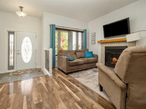695 Parkside Drive, Coaldale, AB - Indoor Photo Showing Living Room With Fireplace