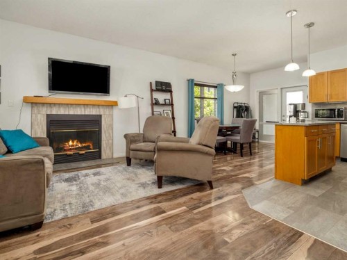 695 Parkside Drive, Coaldale, AB - Indoor Photo Showing Living Room With Fireplace