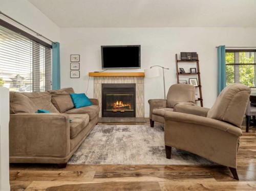 695 Parkside Drive, Coaldale, AB - Indoor Photo Showing Living Room With Fireplace