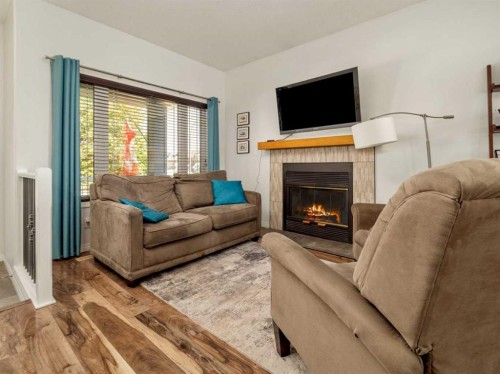 695 Parkside Drive, Coaldale, AB - Indoor Photo Showing Living Room With Fireplace