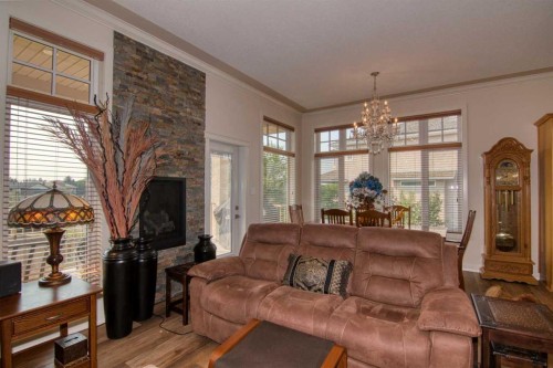44 Fairmont Point South, Lethbridge, AB - Indoor Photo Showing Living Room With Fireplace