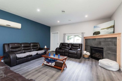 116 S 1 Street West, Magrath, AB - Indoor Photo Showing Living Room With Fireplace