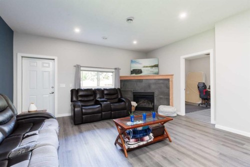116 S 1 Street West, Magrath, AB - Indoor Photo Showing Living Room With Fireplace