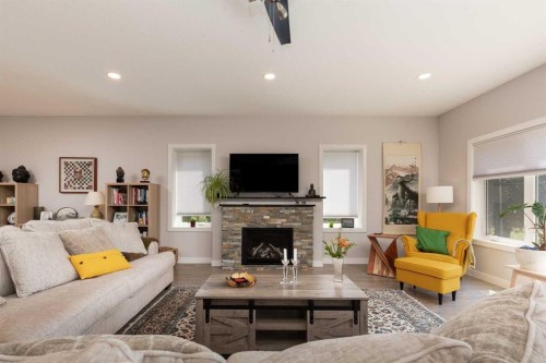 319 Canyon Boulevard West, Lethbridge, AB - Indoor Photo Showing Living Room With Fireplace