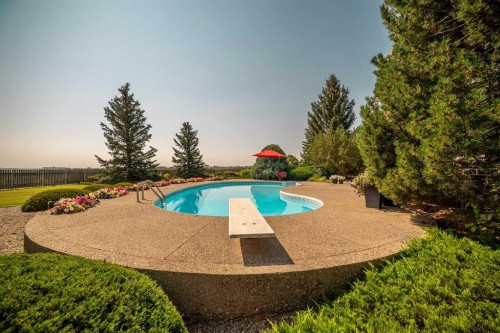 33 Ridgewood Crescent West, Lethbridge, AB - Outdoor With In Ground Pool
