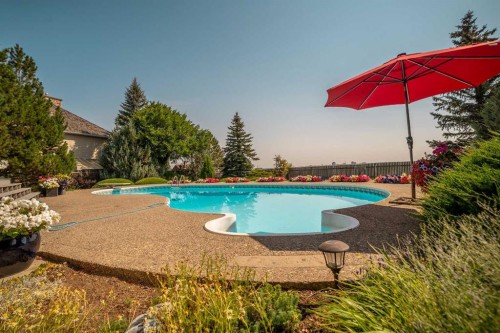 33 Ridgewood Crescent West, Lethbridge, AB - Outdoor With In Ground Pool