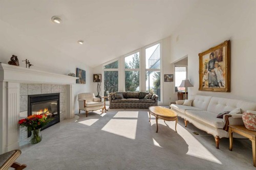 33 Ridgewood Crescent West, Lethbridge, AB - Indoor Photo Showing Living Room With Fireplace