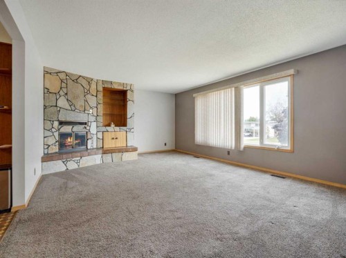 1114 Great Lakes Road South, Lethbridge, AB - Indoor With Fireplace