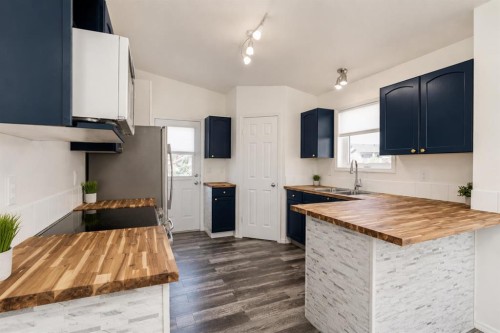 248 Blackfoot Road West, Lethbridge, AB - Indoor Photo Showing Kitchen With Double Sink