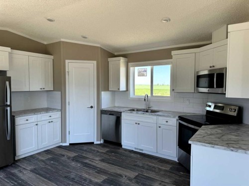 6, 10, 14 Meadows Crescent, Taber, AB - Indoor Photo Showing Kitchen With Double Sink