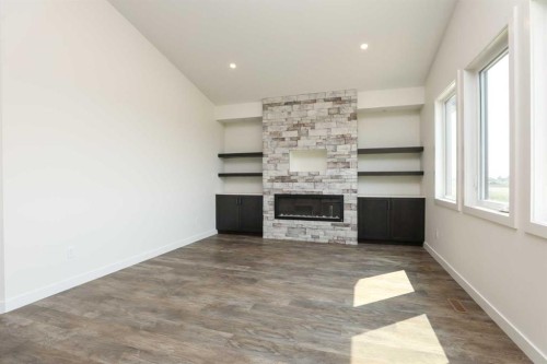 562 Malahat Green West, Lethbridge, AB - Indoor Photo Showing Other Room With Fireplace