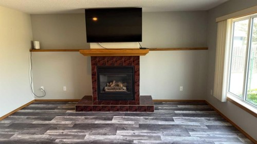 47 Chilcotin Crescent West, Lethbridge, AB - Indoor With Fireplace